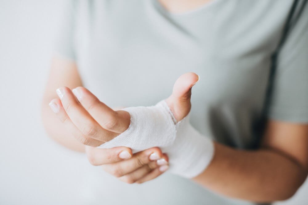 First-aid bandage close up on hands